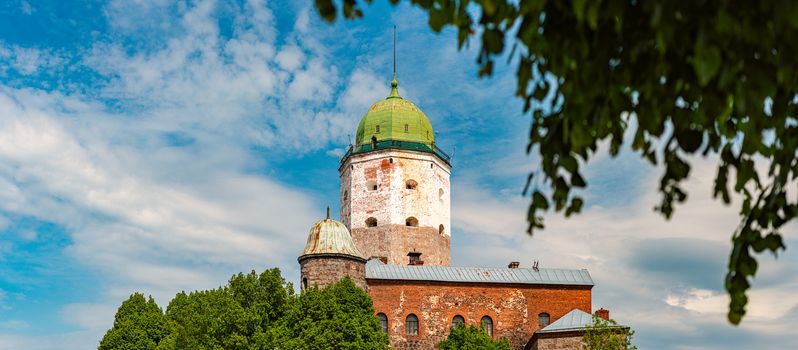 Architecture of old town Vyborg, Russia, Europe. Saint Olaf tower and Vyborg castle on summer day.