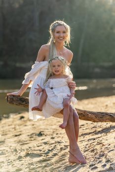 A beautiful young mother and her daughter enjoy the spring weather