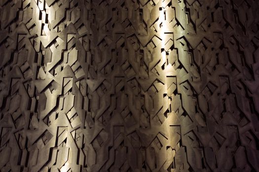 Light glow on grill pattern. Dark grainy industrial abstract background.