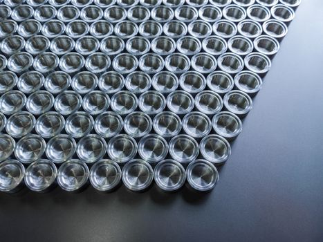 Shiny metal parts after cnc turning, on flat surface top-down flat lay background.