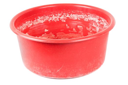 old dirty and scratchy red handwash basin isolated on white background.