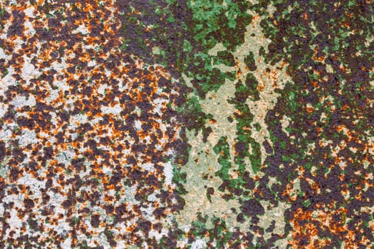 corroded peel paint metal surface background with spots of rust, white and green paint
