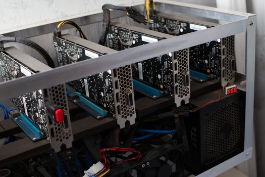 stopped domestic gpu cryptocurrency mining rig under layer of dust with selective focus