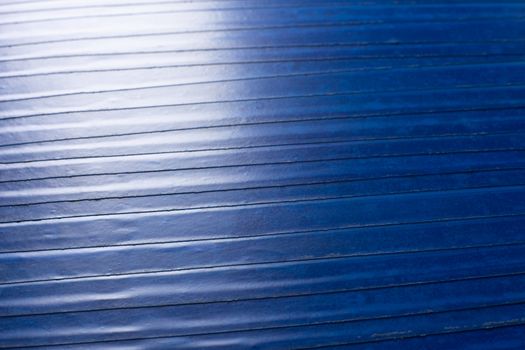 old blue pvc duct tape flat background with selective focus and shallow depth of field and natural optical blur