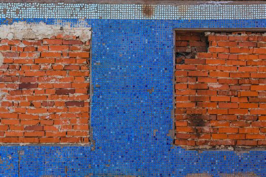 Brick filled windows on blue glass tiles wall flat background