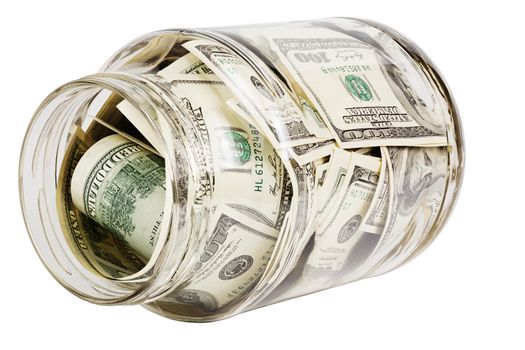 glass jar full of hundred us dollar banknotes laying on side - isolated on white background