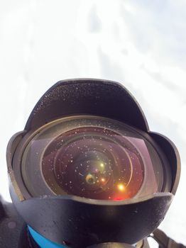 Frosted ultra wide angle lens front element at winter daylight.