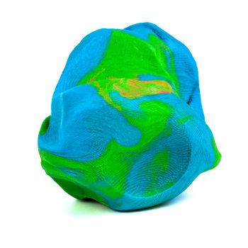 Mixed blue-green-red playdough ball with distinct fingerprints isolated on the white background. Front to end sharp. Small dust particles on surface.