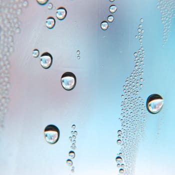 Drops of water on the crooked glass, shallow dof