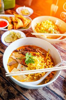 Northern Thai  Curried noodle soup (Khao soi) with chicken meat and spicy coconut milk 