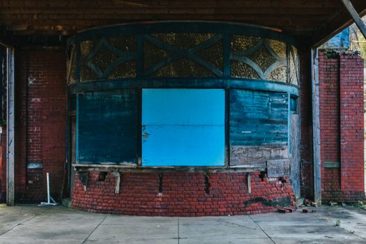 A Boarded Up Ticket Booth at an Abandoned Train Station