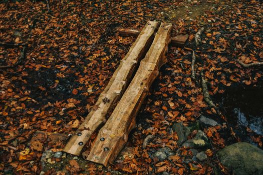 A Small Man-Made Wooden Bridge Used to Cross a Creek