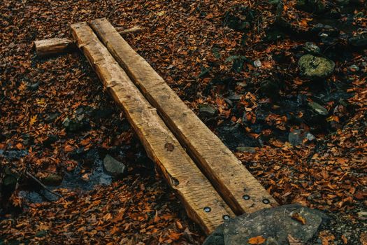 A Small Man-Made Wooden Bridge Used to Cross a Creek