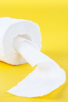 Tissue paper rolls on the yellow background.