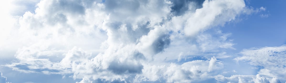 Panoramic white fluffy clouds in the blue sky, Fantastic soft white clouds against blue sky