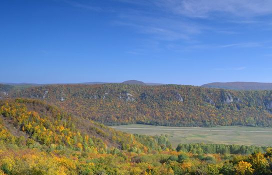 Autumn landscape, tree over mountains