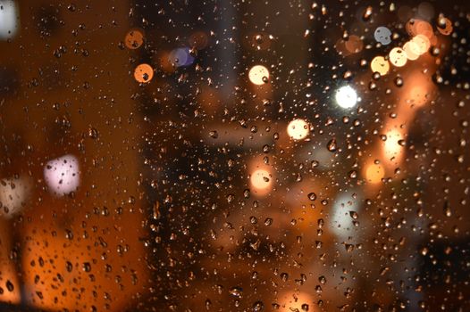 Rain drops on night window, shallow dof