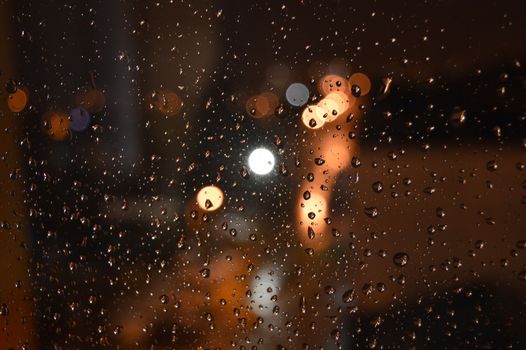 Rain drops on night window, shallow dof