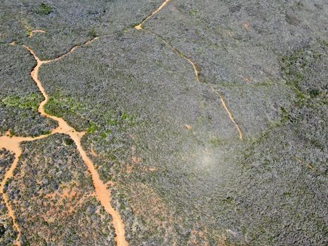 Aerial top view of Black Mountain in Carmel Valley, San Diego, California, USA. Green dry mountain during with hiking trails, perfect for hiking .