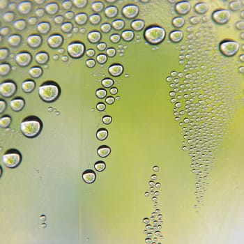 Drops of water on the crooked glass, shallow dof