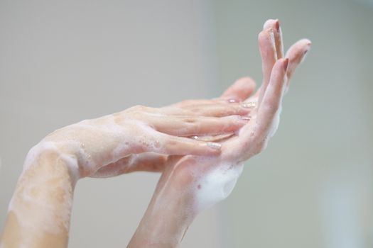 Washing hands with soap. For killing germs, bacteria and virus.