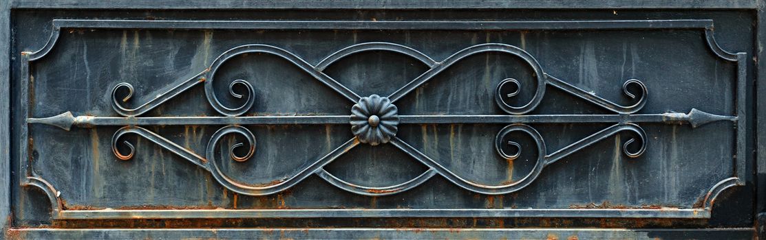 Rectangular element of black rusted forged fence without any transparency