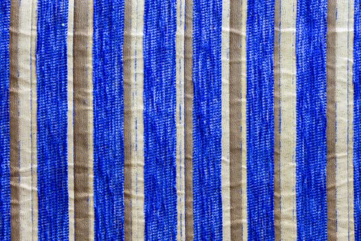 striped synthetic woven upholstery fabric close-up texture and background