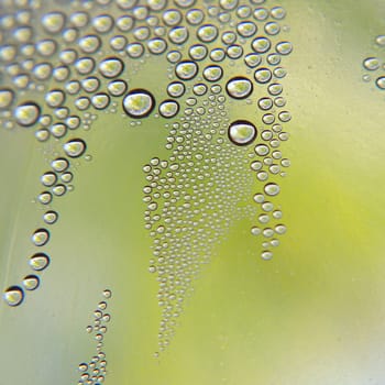 Drops of water on the crooked glass, shallow dof