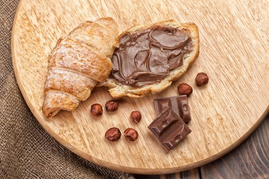 Pastry and chocolate on a wooden desk