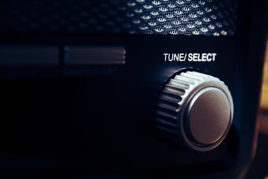 Tune Select button on a vintage and retro analogue radio. Finetuning the radio station. Creative and vintage processing. Selective focus.
