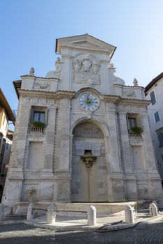 spoleto,itali august 07 2020:fountain of clock in the center of spoleto