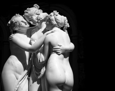 Milan, Italy - June 2020: Antonio Canova’s statue The Three Graces (Le tre Grazie). Neoclassical sculpture, in marble, of the mythological three charites (made in Rome, 1814-1817)