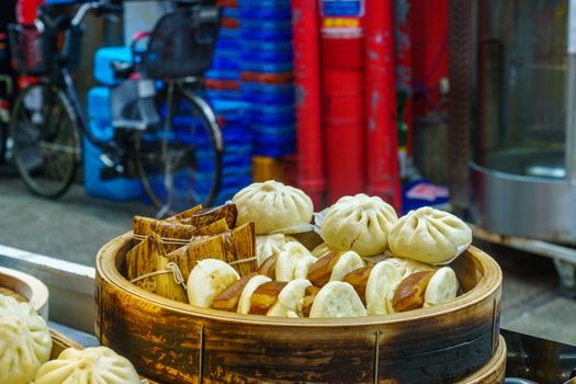 Street food on sale in Nankin-machi neighborhood, Chinatown, in Kobe, Japan