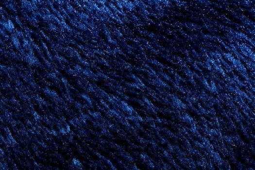 Close-up view of a piece of dark blue fabric. Macro shot. Texture.