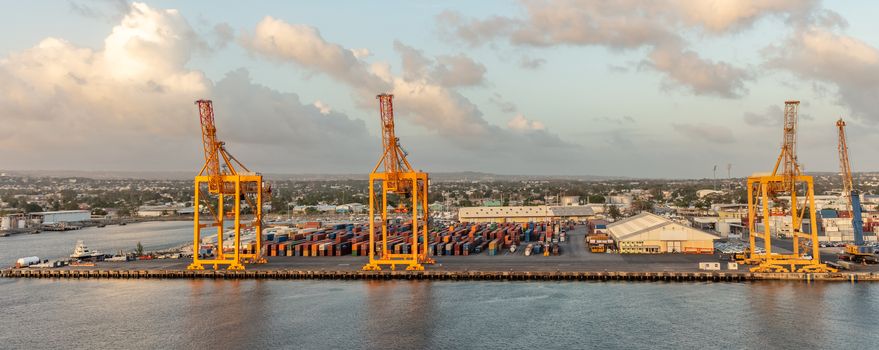 Bridgetown port, Barbados, West Indies - May 2, 2020: Bridgetown port with loading cranes and containers