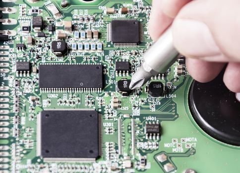 repairing a printed circuit board. Micro technology and repairs. Electronic components and conductors