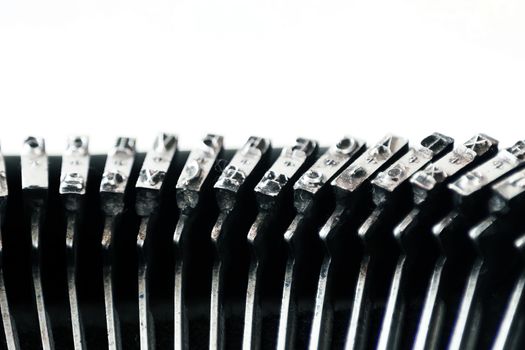 the iron hammers with the letters imprinted inside an old typewriter. Mechanical tools for writing. Old time journalism