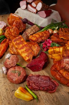 Different kinds of meat and vegetables on a studio background