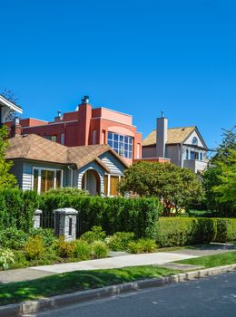 Residential houses on a street on sunny day in Vancouver, Canada