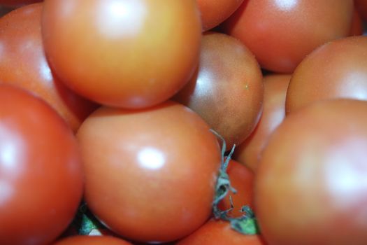 Close-up view of red tomatoes in market for sale. A fruit background for text and advertisements