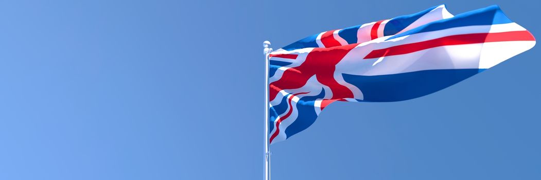 3D rendering of the national flag of British waving in the wind against a blue sky