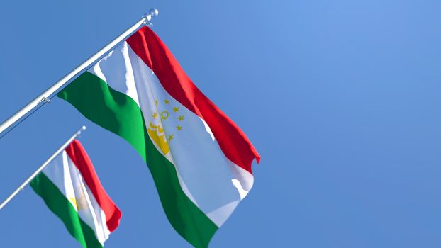 3D rendering of the national flag of Tajikistan waving in the wind against a blue sky