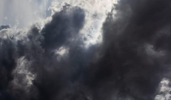 Gray summer storm clouds full frame background. Zenith view from ground surface.