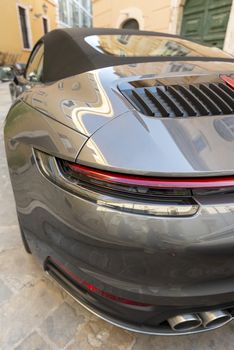 detail of the left rear of a sports car with headlight