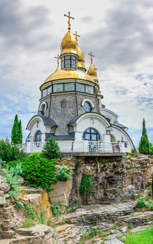 Buki, Ukraine 06.20.2020. Temple Complex with landscape Park in Buki, Ukraine, on a cloudy summer day