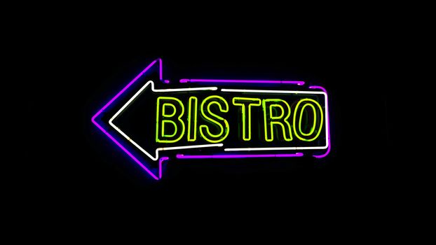 Bistro neon sign in night and black background.