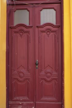 vintage entrance wooden brown door with glass close-up