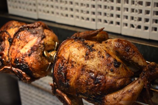 Fresh Cooked Rotisserie Chicken Still Rotating Inside the Rotisserie