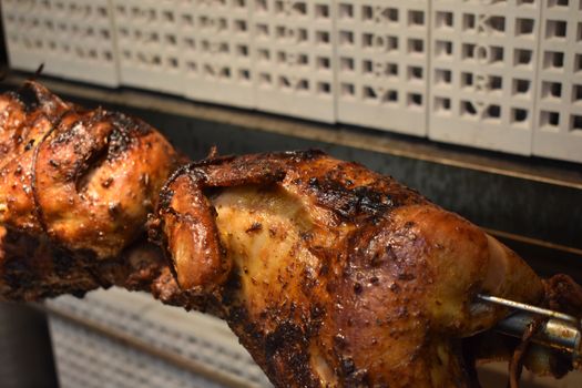 Fresh Cooked Rotisserie Chicken Still Rotating Inside the Rotisserie