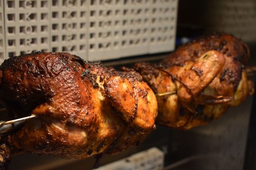 Fresh Cooked Rotisserie Chicken Still Rotating Inside the Rotisserie